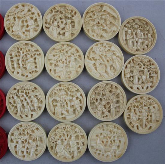 Thirty one Chinese export ivory chess / draught counters, late 19th century, each 3.5cm diam.